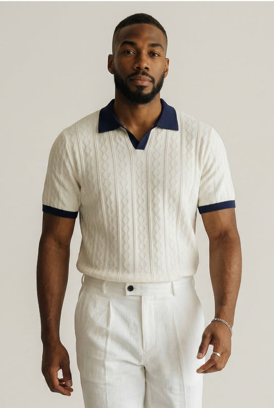 Tuck It cream cable knit short sleeve polo shirt with navy collar and cuffs.