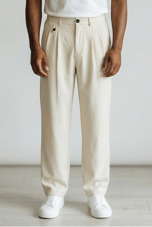 Tuck It beige pleated trousers with a relaxed fit and button closure. Made from a cotton blend.
