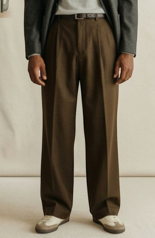 Tuck It brown pleated wool trousers with a classic fit and a dark leather belt.