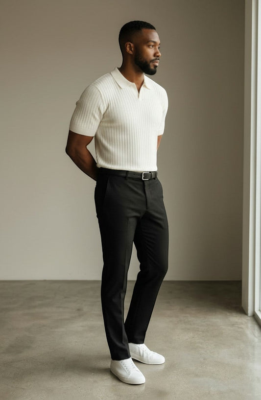 Tuck It cream ribbed short-sleeve knit polo shirt with a spread collar and black tailored trousers.