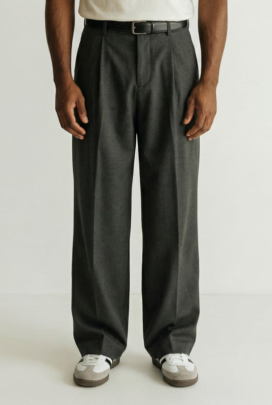 Tuck It dark grey pleated wool blend trousers with a relaxed fit and a black leather belt.