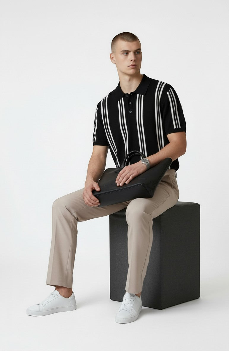 Tuck It Monaco black knit polo shirt with white vertical stripes, short sleeves, and button collar.