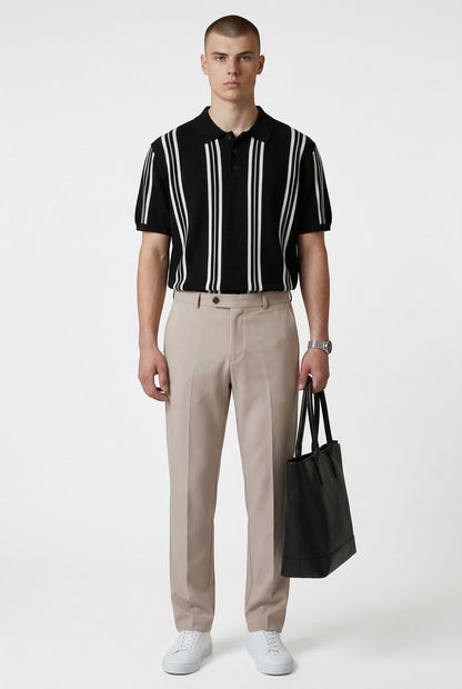 Tuck It Monaco black knit polo shirt with white vertical stripes and a classic collar.