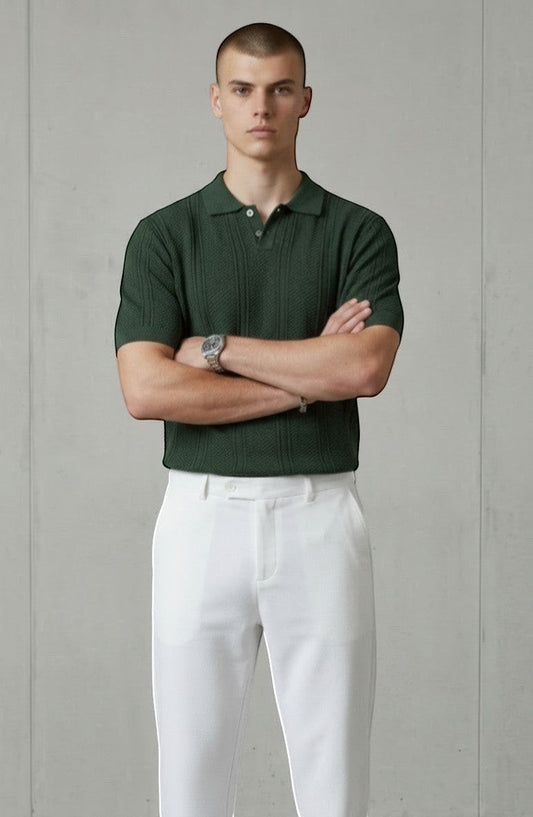 Tuck It Verde Heritage Knit Polo, a dark green short-sleeve knit polo shirt with a textured pattern and button placket.
