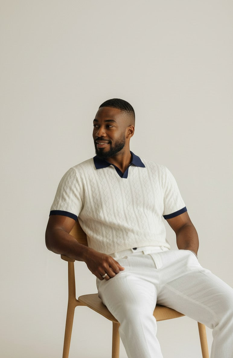 Tuck It white cable knit short sleeve polo with navy collar and cuffs.