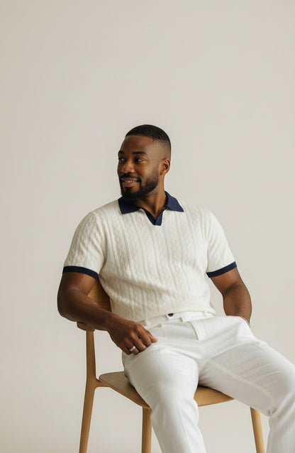 Tuck It white cable knit short sleeve polo with navy collar and cuffs.